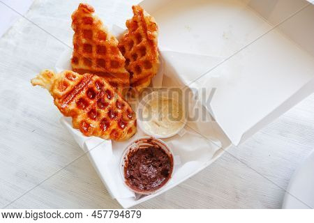 Croissant Waffle Or Croffle With Chocolate Sauce Served In Box And White Background