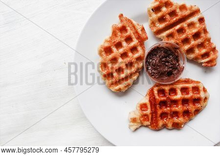 Croissant Waffle Or Croffle With Chocolate Sauce Served In Box And White Background