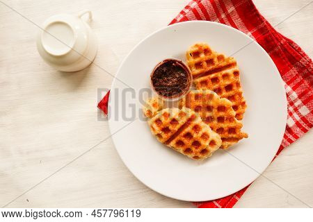 Croissant Waffle Or Croffle With Chocolate Sauce Served In Box And White Background