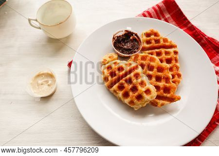 Croissant Waffle Or Croffle With Chocolate Sauce Served In Box And White Background