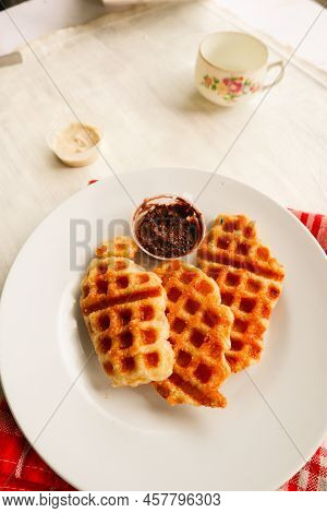 Croissant Waffle Or Croffle With Chocolate Sauce Served In Box And White Background