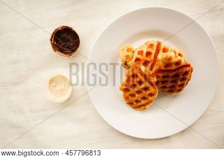 Croissant Waffle Or Croffle With Chocolate Sauce Served In Box And White Background