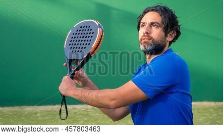 Man Who Playing Padel Tennis With Space For Text. Caucasian Player Sportsman.
