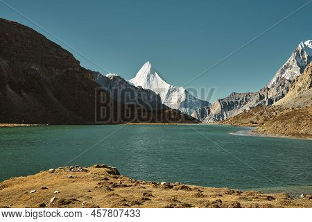 Mount Jampayang And Lake Boyongcuo In Yading National Park, Daocheng County, Sichuan Province, China