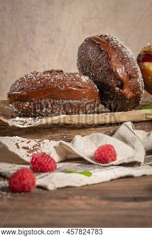 Bolas De Berlim, Or Berlin Balls. Portuguese Fried Dough With Sugar, Filled With Chocolate Or Raspbe