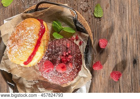 Bolas De Berlim, Or Berlin Balls. Portuguese Fried Dough With Sugar, Filled With Chocolate Or Raspbe