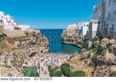 Polignano A Mare, Puglia, Italy - August 30 2021: Beautiful View Of Polignano A Mare With White Ston