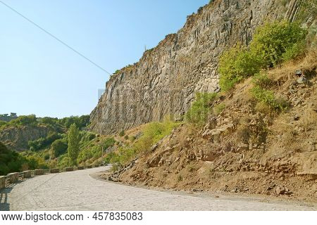 Mountain Road To The Symphony Of Stones With Temple Of Garni On The Hilltop In Afar, Garni Gorge, Vi
