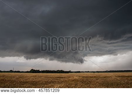 A Wall Cloud Underneath A Severe Storm Over A Dry Field In Kansas.