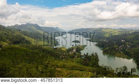 Aerial Drone Of Hills With Tea Plantations Around The Lake In The Mountains. Maskeliya, Castlereigh,