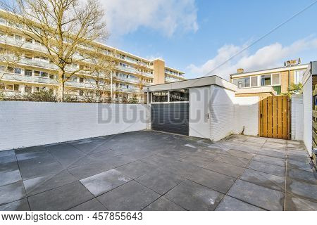 Patio Of A Modern Houseinterior Courtyard Of A Modern House With A View Of The Houses Opposite And B