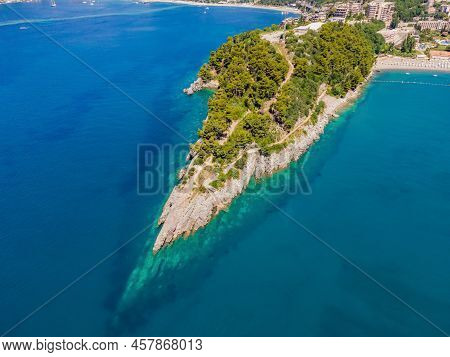 Picturesque Sea Adriatic Coast Of Montenegro. Turquoise Mediteran Sea And Rocky Shore With Evergreen