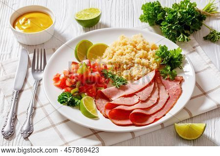 Thinly Sliced Roast Beef Fillet With Quinoa And Tomato Pepper Salsa On White Plate On White Wooden T