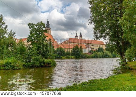 Beautiful View On Telc In Czechia Cloudy Sky Seen From The Surrounding River. The Historic Center Of
