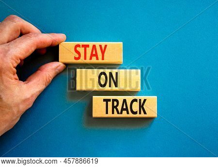 Stay On Track Symbol. Concept Words Stay On Track On Wooden Blocks On A Beautiful Blue Table Blue Ba