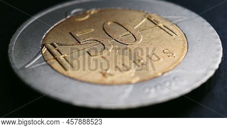 Translation: 50 Kurus. Turkish Coin Of 50 Kuruş Lies On A Dark Surface Close-up. National Currency O