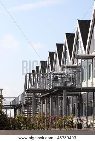 Apartments On The Backside Of Yacht Harbor With Steel Ladders
