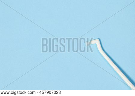 Orthodontic Toothbrush With One Bundle For Braces On A Blue Background Special Tool For Oral Care