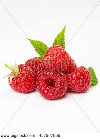 Ripe Raspberries With Leaf Isolated On A White Background