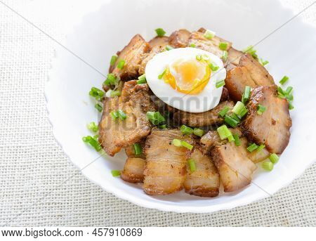 Bowl Of Rice Topped With Braised Pork Belly And Boiled Egg, Japanese Called Kakuni-don