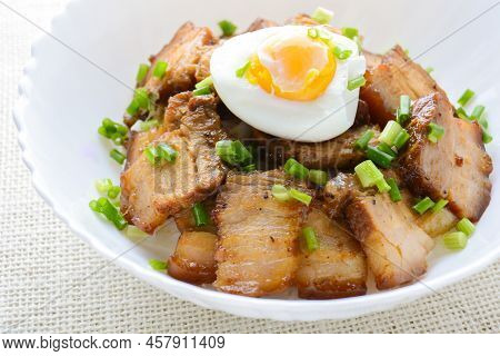 Bowl Of Rice Topped With Braised Pork Belly And Boiled Egg, Japanese Called Kakuni-don