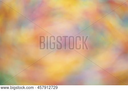 Blurred Multicolor Abstract Background. Shades Of Yellow, Pink, Blue And Green.