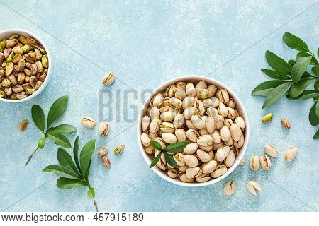 Pistachios. Whole Pistachios With Green Leaves And Pistachio Nut Kernels. Healthy Natural Vegetarian