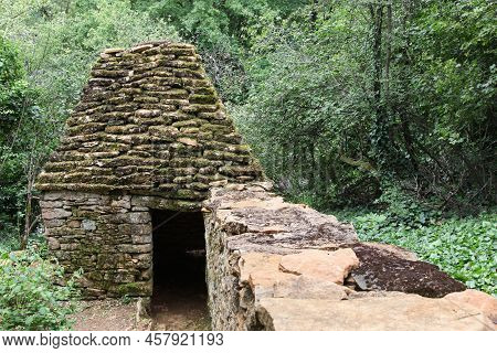 Old And Typical Stone Hut Called Cadole In French Language In Beaujolais, France