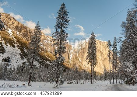 View From The Snow-covered Valley Floow In Yosemite National Park During Golden Hour, Just Before Su