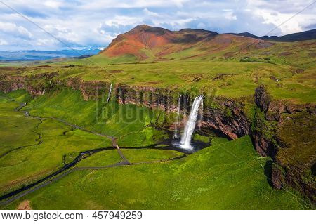 Aerial View Of Seljalandsfoss Waterfall, Seljalands River And Waterfall Parking In Iceland.