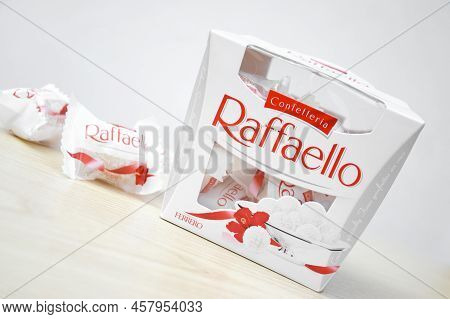 Kharkiv, Ukraine - October 23, 2021: Raffaello Sweets On A Light Wooden Table And White Background. 