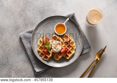 Trendy Breakfast With Croffles And Morning Coffee, Strawberries. Croissant As Waffle.