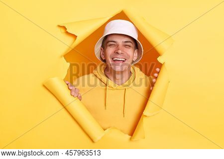 Portrait Of Extremely Happy Man Wearing Hoodie And Panama, Laughing Loud Out, Looking At Camera, Hea