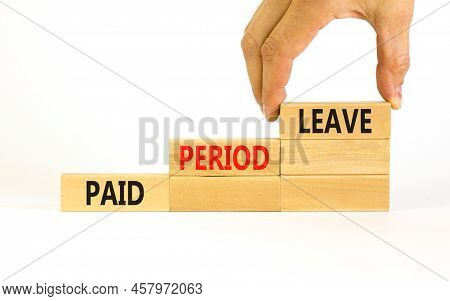 Paid Period Leave Symbol. Concept Words Paid Period Leave On Wooden Blocks. Beautiful White Table Wh
