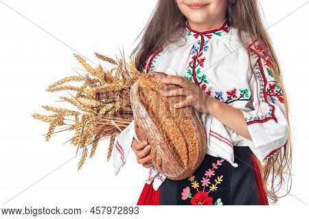 Portrait Of A Beautiful Girl Woman In Traditional Bulgarian Folklore Dress Holding Homemade Bread An