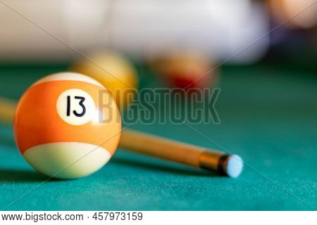 Billiard Thirteen Ball On Green Tapestry And More Balls In The Backgrownd