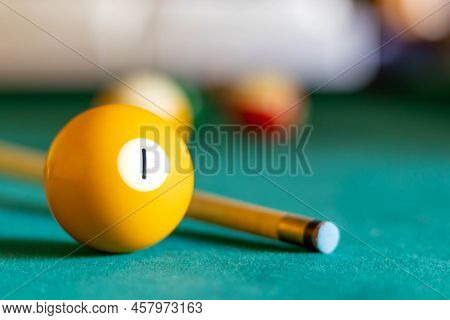 Billiard One Ball On Green Tapestry And More Balls In The Backgrownd