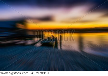 Zooming The Focus Ring On The Camera As A Boat Was Being Launched At Okarito Lagoon At Sunrise
