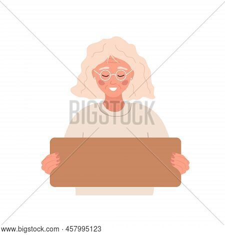 Elderly Woman Holding Cardboard Blank Sign. Template For Your Slogan. Paper With Copy Space For Text