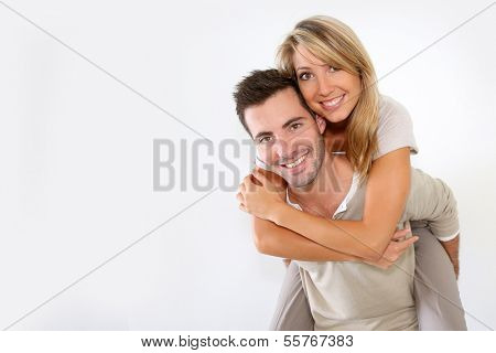 Cheerful couple standing on white background