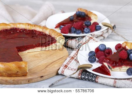 Raspberry Cake And Slices Of Cake With Fresh Berries
