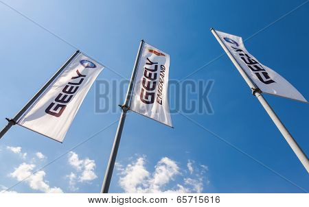 Samara, Russia - May 25, 2014: The Flags Of Geely Over Blue Sky. Geely Is A Chinese Automotive Manuf