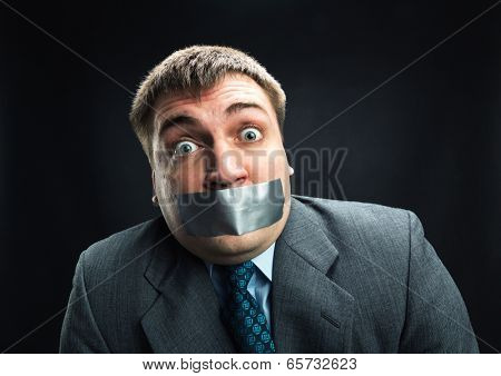 Man with mouth covered by masking tape