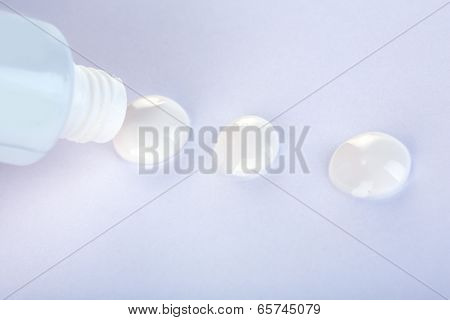 Toothpaste squeezed from tube, close-up, on white background