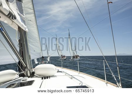 AEGEAN SEA, GREECE - APR 29, 2014: Unidentified sailboats participate in sailing regatta 