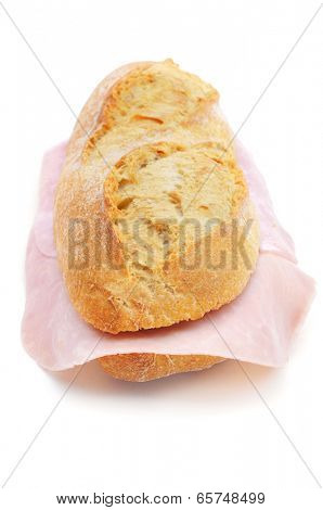 closeup of a spanish bocadillo de jamon de york, a ham sandwich, on a white background