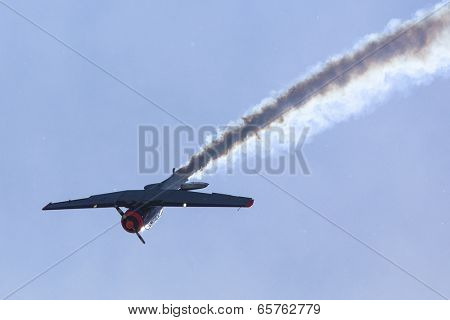 BERLIN, GERMANY - MAY 20, 2014: The aircraft Red Bull Noorduyn AT-16 D-FHGK demonstration during the International Aerospace Exhibition ILA Berlin Air Show-2014.