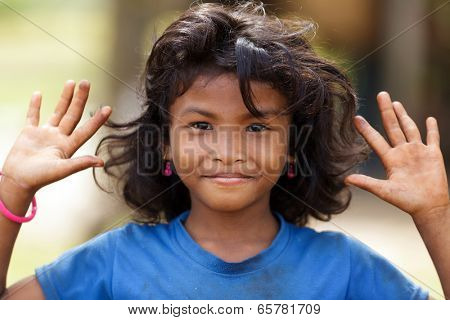 SIEM REAP, CAMBODIA, DECEMBER 04 : Cambodian little girl close portrait in a village near Siem Reap, Cambodia on December 04, 2012