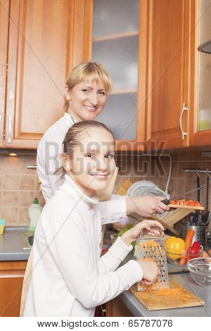 Positive Caucasian Family Preparing Food Together And Having Good Time