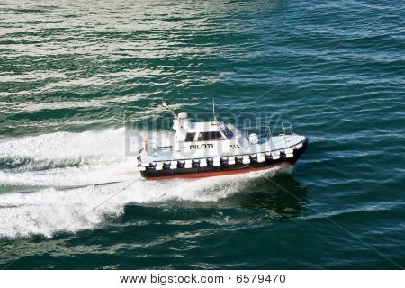 Italian Pilot Speeding Across Blue Water